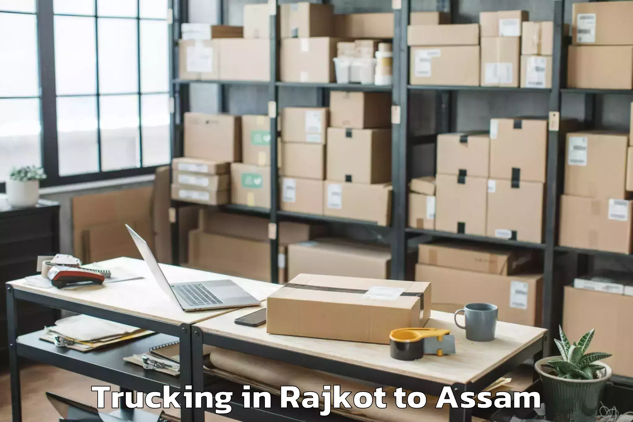 Book Rajkot to Baganpara Pt Trucking Online